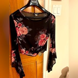 Beautiful lightweight sheer blouse with flared sleeves.